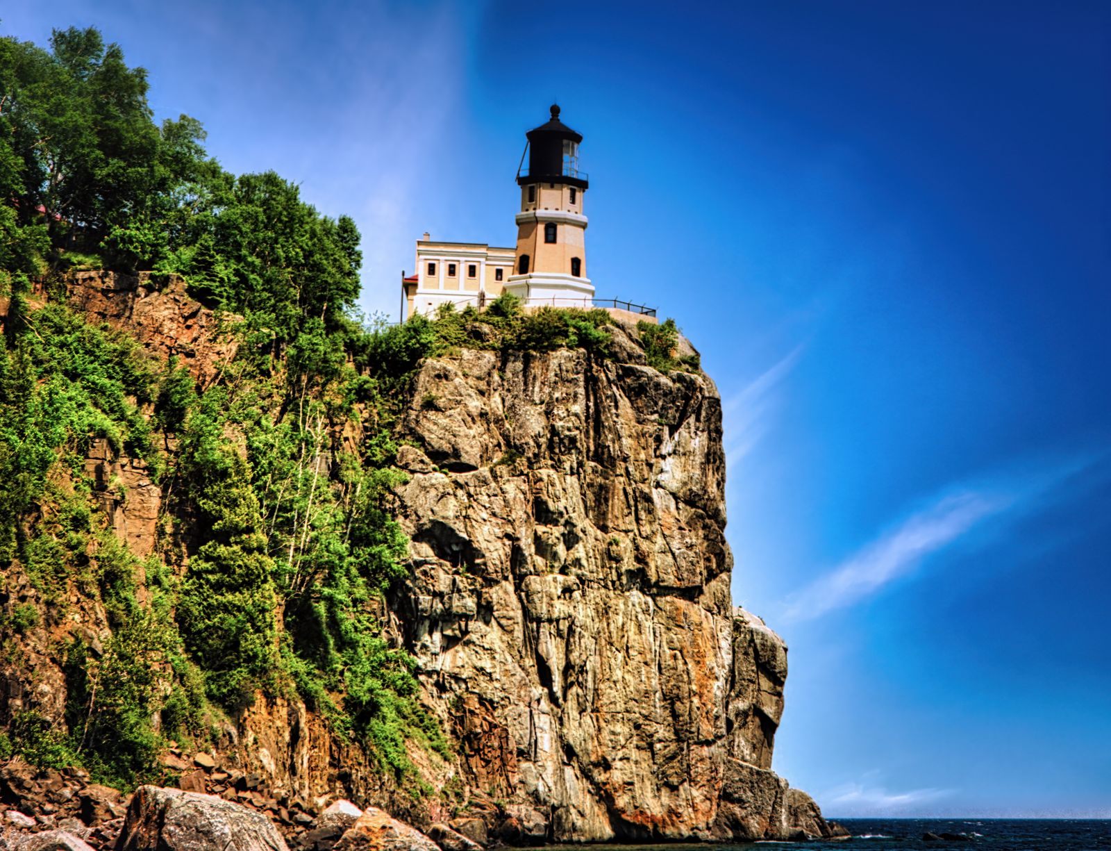 Split Rock Lighthouse on top of a sheer rock cliff above Lake Superior, one of the best places to visit in Minnesota